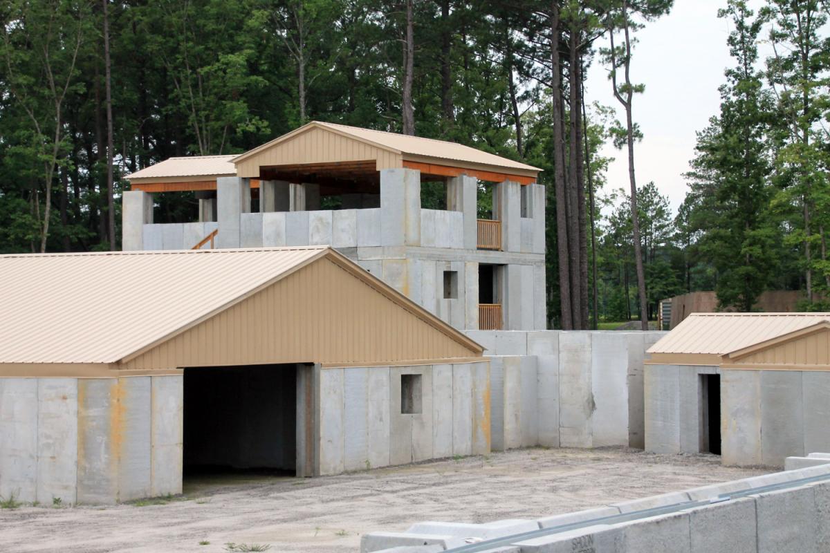 SACON Assault Compound with three-story main building, auxiliary buildings, grenade house, and perimeter wall. SACON Assault Compound with three-story main building, auxiliary buildings, grenade house, and perimeter wall.