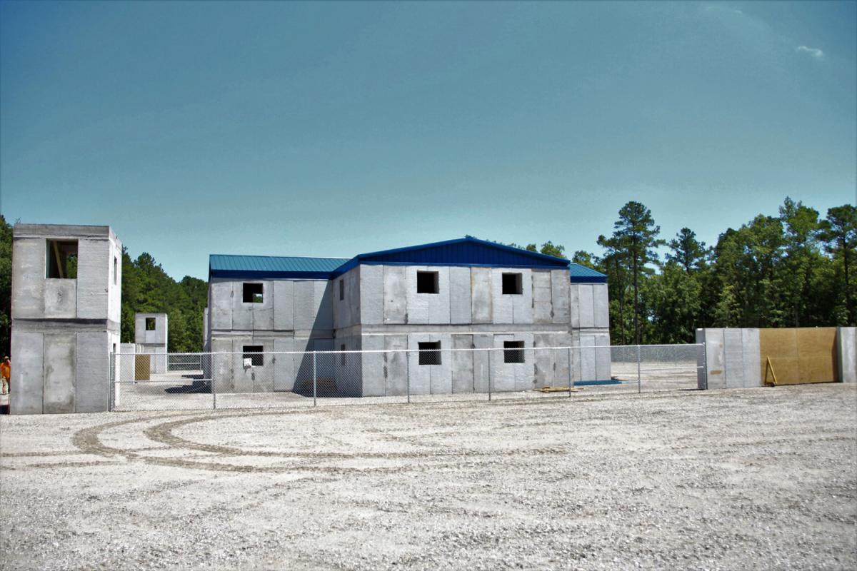 Government complex under construction with two-story guard towers. Government complex under construction with two-story guard towers.